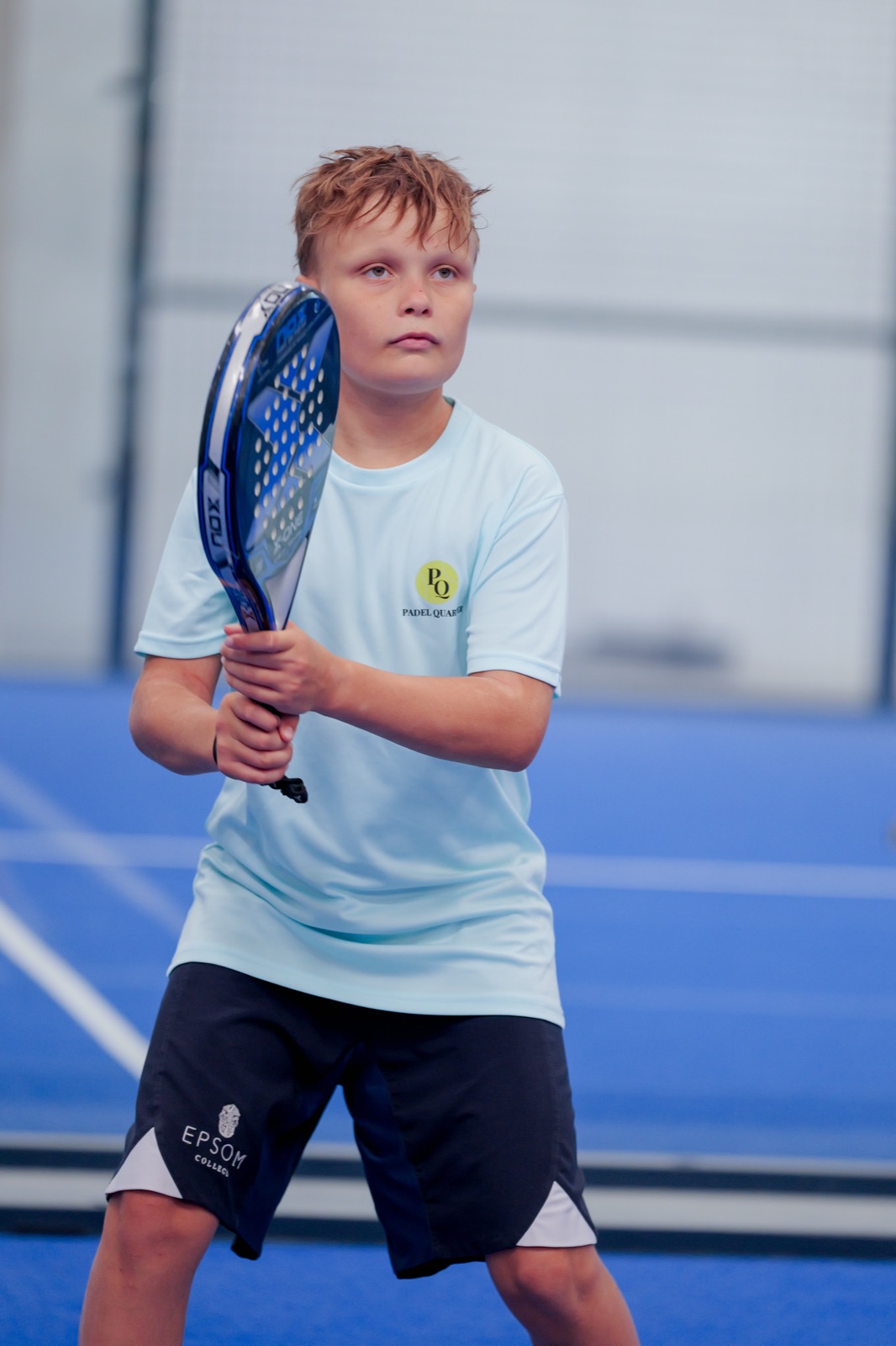 A junior player ready at the net